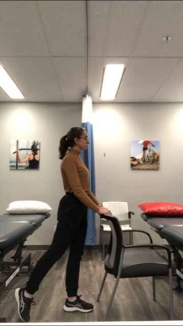 Demo of standing backward leg slides