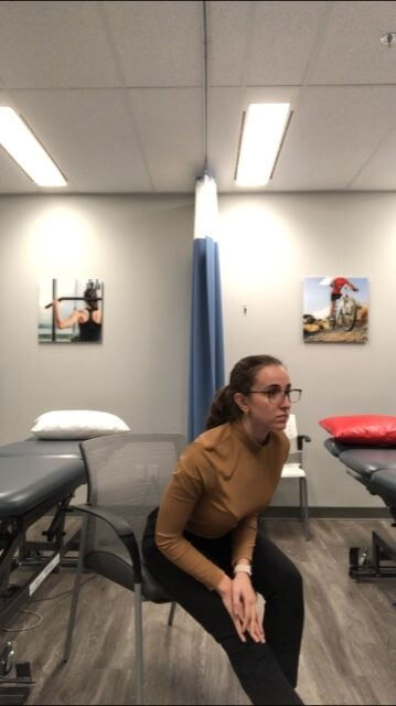 demo of seated hamstring stretch