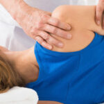 shoulder pain being treated by Physiotherapist. PhysioPlus