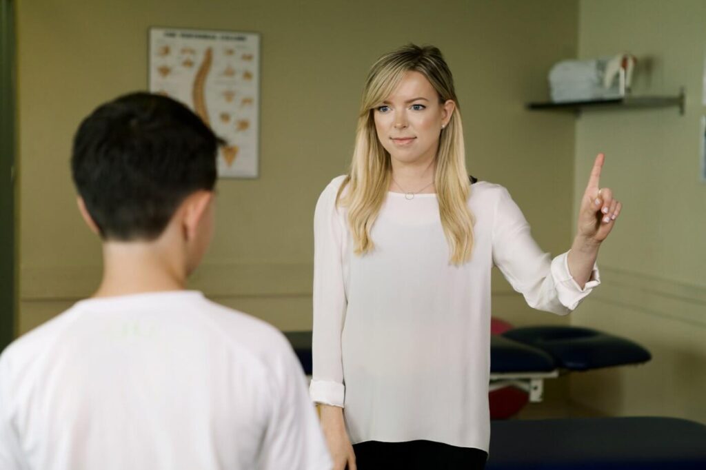 Vestibular physiotherapist treating a patient after a concussion