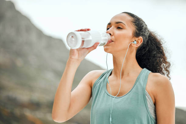 a woman taking a break to re-hydrate