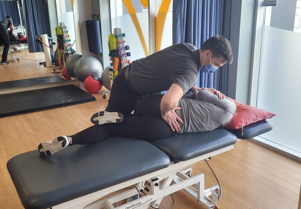 Chiropractor treating a patient with back pain