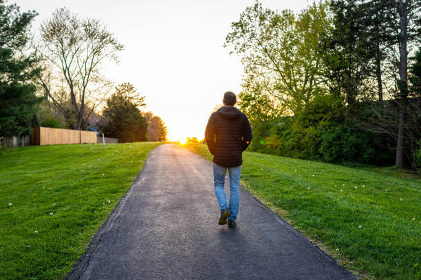 A man going on a walk in the neighbourhood