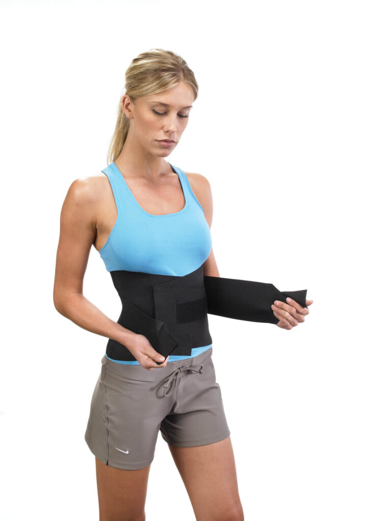 woman wearing flexible back brace