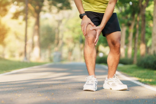 Young male runner have knee ache due to Runners Knee or Patellofemoral Pain Syndrome