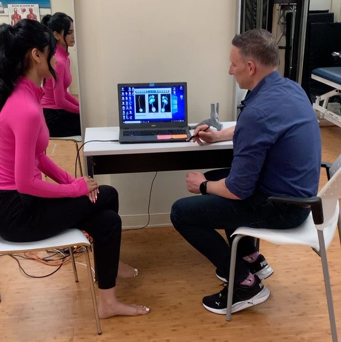 a podiatrist and patient having a consultation