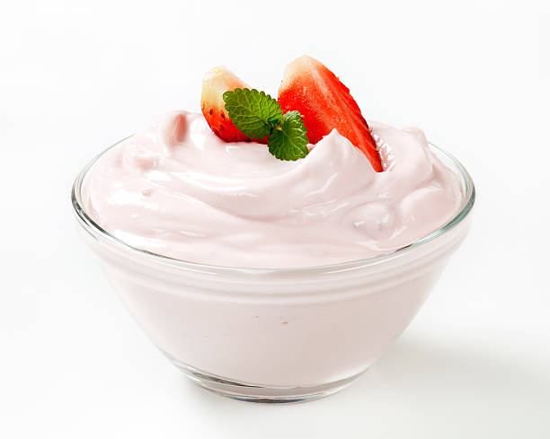 yogurt with strawberries and mint in a small glass bowl