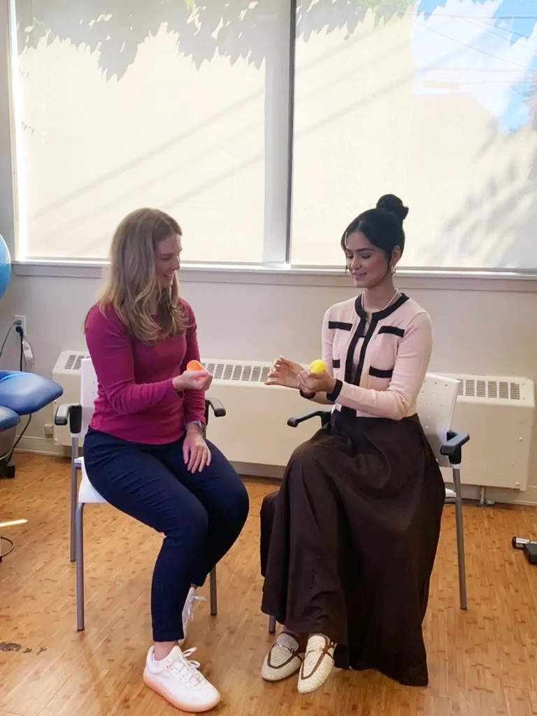 Occupational Therapist helping patient with hand issue